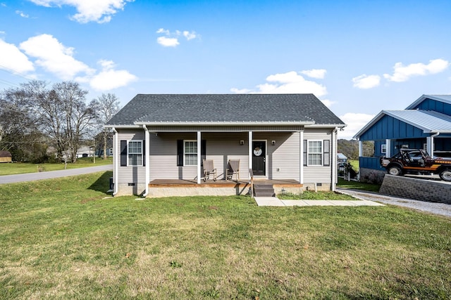 bungalow with a front lawn and a porch