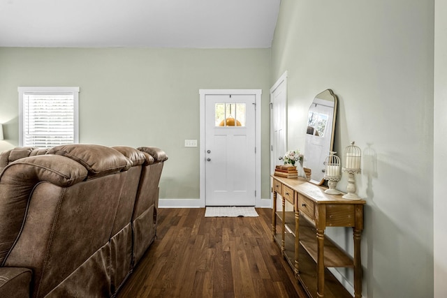 entryway with dark hardwood / wood-style flooring