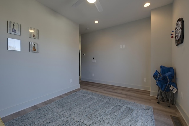unfurnished room featuring light hardwood / wood-style floors and ceiling fan
