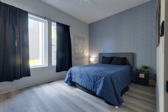 bedroom featuring ceiling fan and light hardwood / wood-style floors