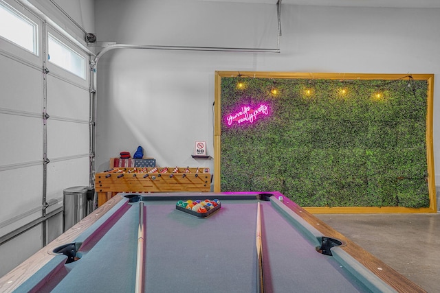 rec room featuring concrete floors and billiards