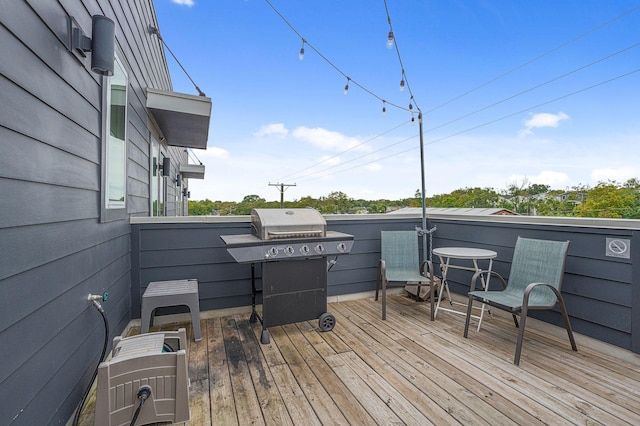 wooden deck with grilling area