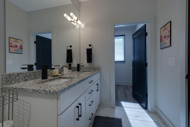bathroom with vanity and tile patterned flooring