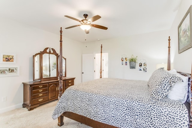 bedroom with ceiling fan and light colored carpet