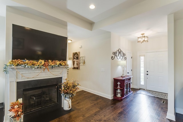 foyer entrance with dark hardwood / wood-style flooring