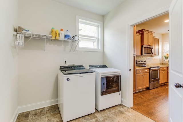 laundry room with separate washer and dryer