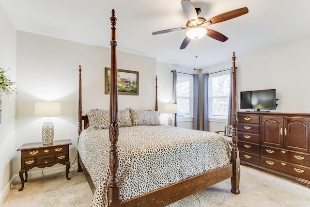 bedroom with ceiling fan and light colored carpet