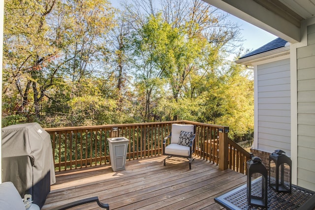 wooden terrace featuring grilling area