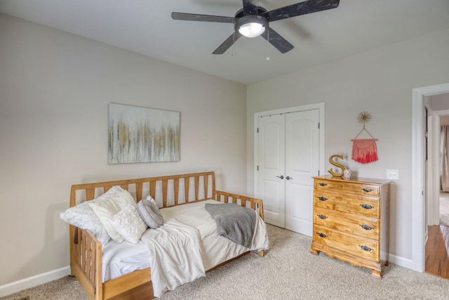 bedroom with ceiling fan, a closet, and carpet floors