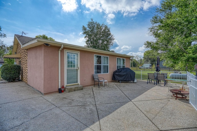 back of property with a patio