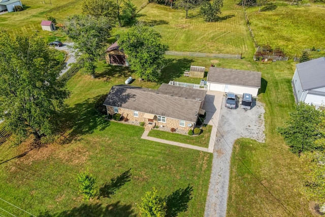 birds eye view of property with a rural view