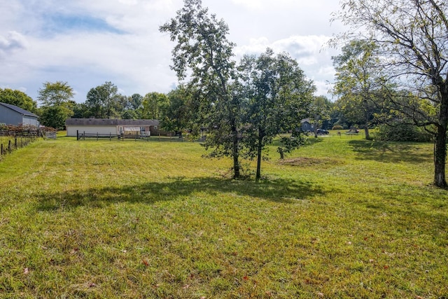 view of yard with a rural view