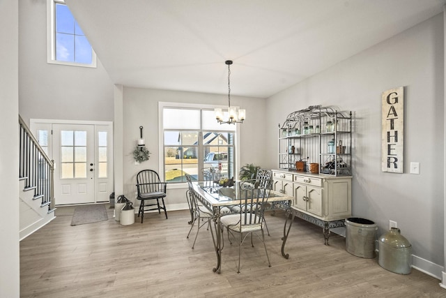 dining room featuring light hardwood / wood-style floors and a notable chandelier