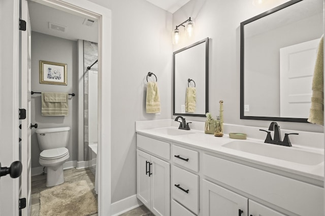 full bathroom featuring toilet, washtub / shower combination, and vanity