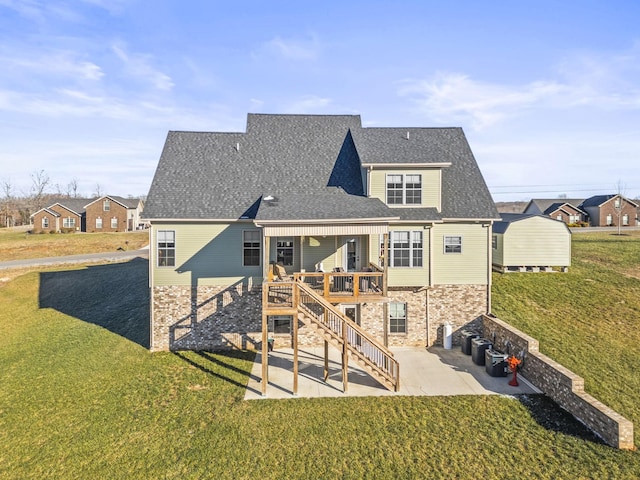 back of house with central AC unit, a wooden deck, a yard, and a patio