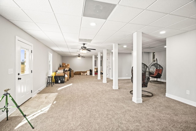 basement with carpet floors and ceiling fan