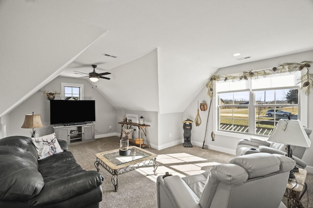 living room with ceiling fan, light colored carpet, and vaulted ceiling