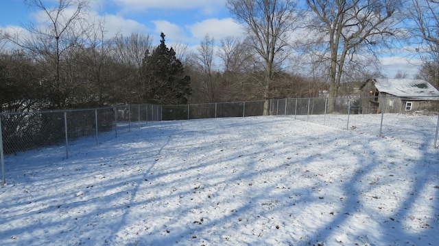 view of yard layered in snow