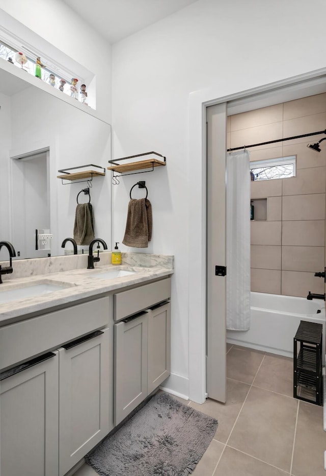 bathroom featuring tile patterned floors, vanity, and shower / bath combo