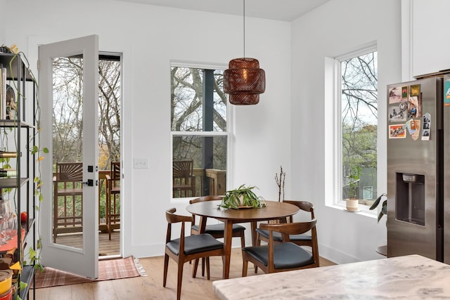 interior space featuring light hardwood / wood-style flooring and french doors