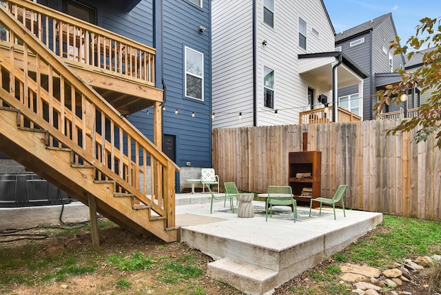 wooden deck with a patio