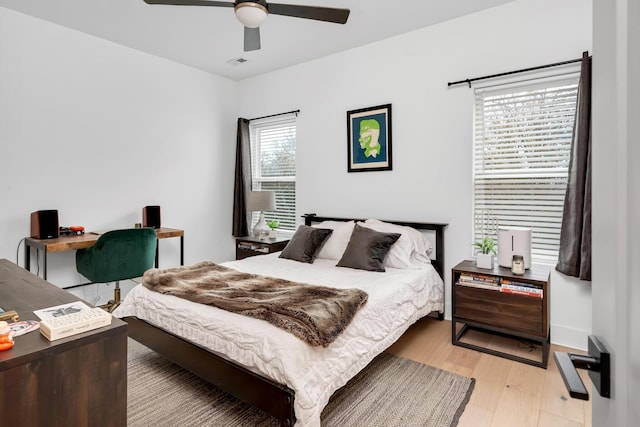 bedroom with light wood-type flooring and ceiling fan