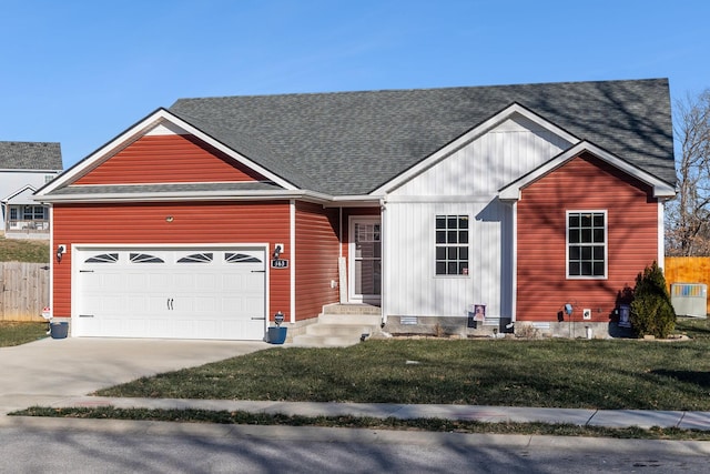 view of front facade with a garage and a front lawn