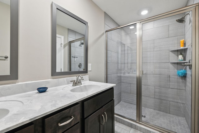 bathroom with an enclosed shower and vanity