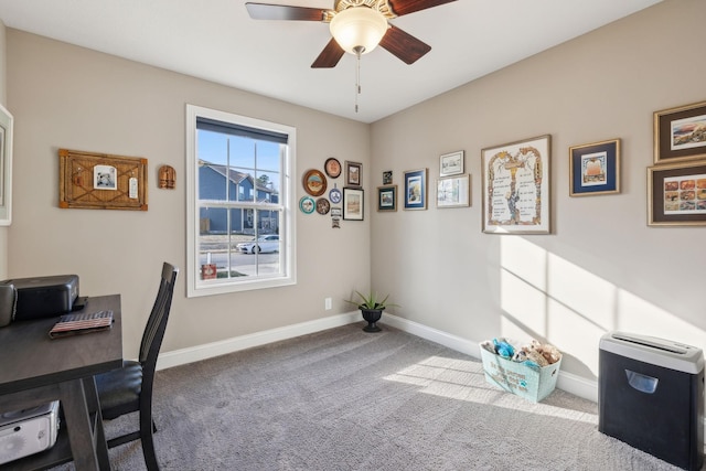 carpeted office featuring ceiling fan