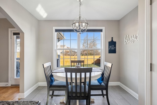 dining space featuring a notable chandelier