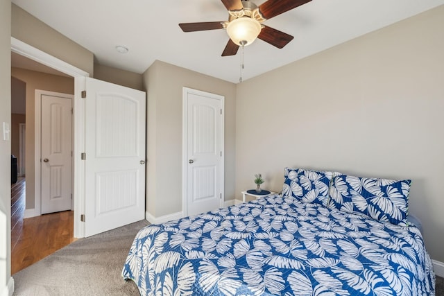 carpeted bedroom with ceiling fan