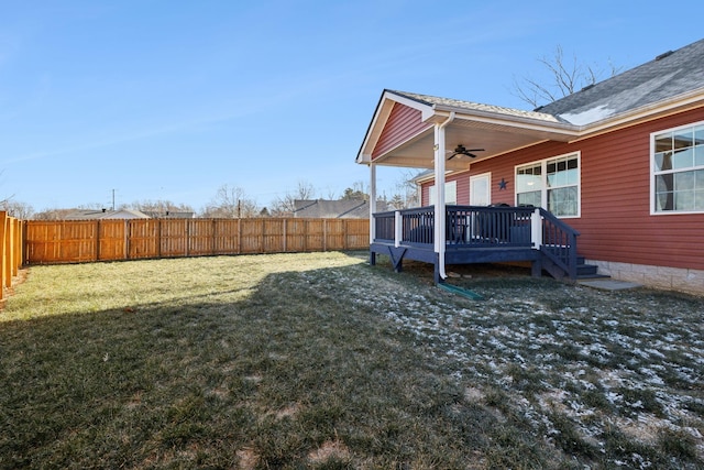 view of yard featuring ceiling fan and a wooden deck