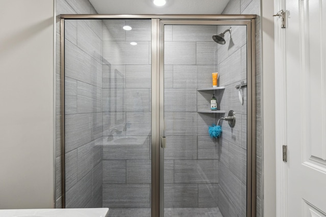 bathroom featuring an enclosed shower