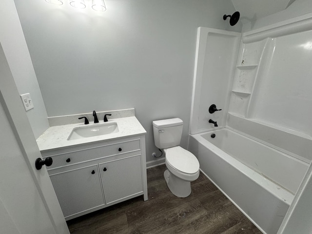 906 Davidson St, Tullahoma, TN 37388 - bathroom with toilet, vanity, wood finished floors, and washtub / shower combination