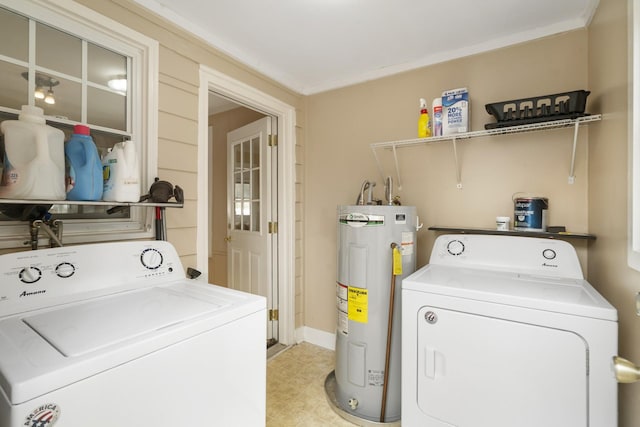 washroom with ornamental molding, electric water heater, and washer and clothes dryer