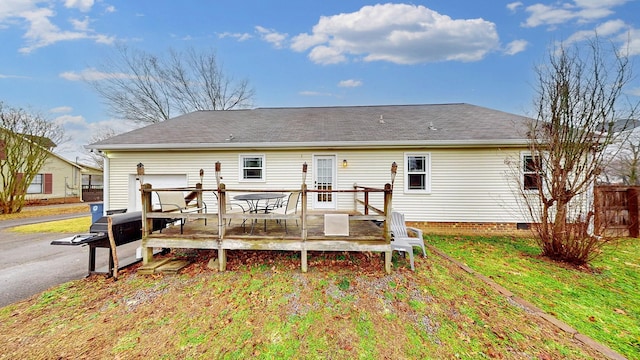 back of property featuring a deck