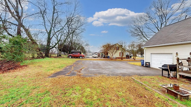 view of yard featuring a garage