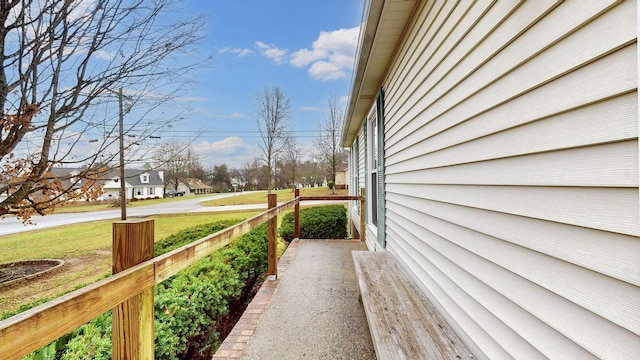 view of side of property featuring a yard