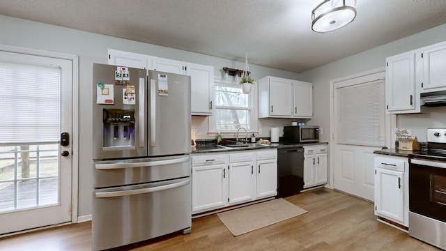 kitchen featuring sink, white cabinetry, and stainless steel appliances