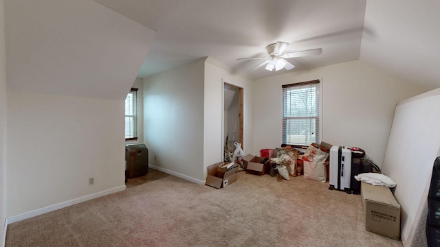 bonus room with light carpet, vaulted ceiling, and ceiling fan