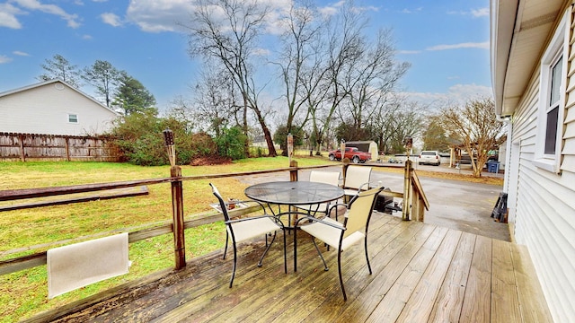 deck featuring a lawn