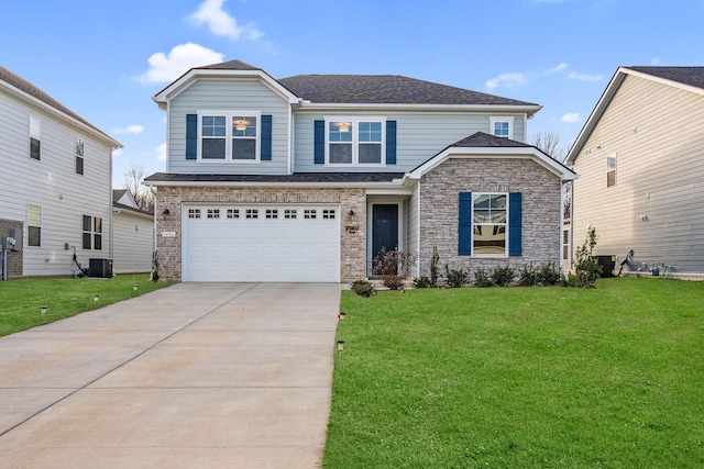 view of front of home with central AC unit, a front yard, and a garage