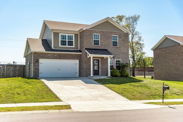 view of front of property featuring a front yard and a garage