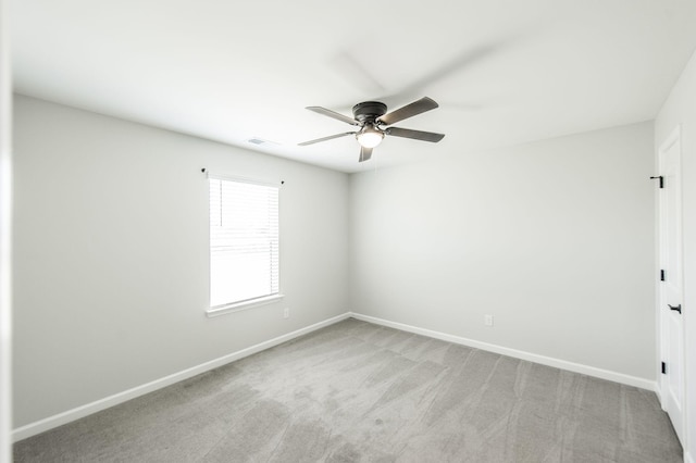 carpeted empty room with ceiling fan