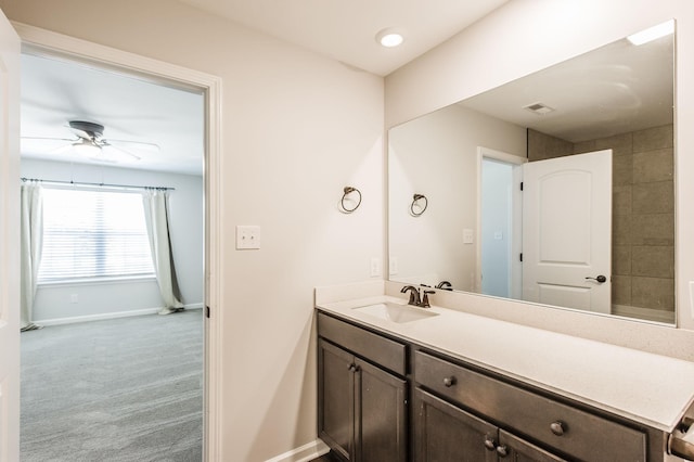 bathroom featuring ceiling fan and vanity