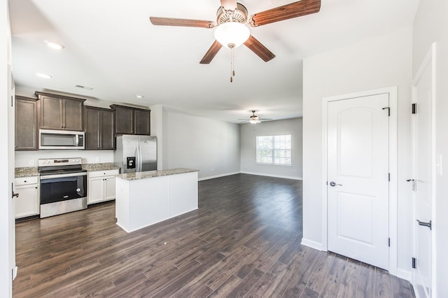 kitchen with white cabinetry, ceiling fan, appliances with stainless steel finishes, dark hardwood / wood-style flooring, and dark brown cabinetry