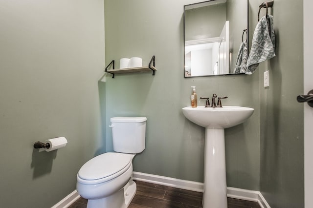 bathroom featuring sink and toilet