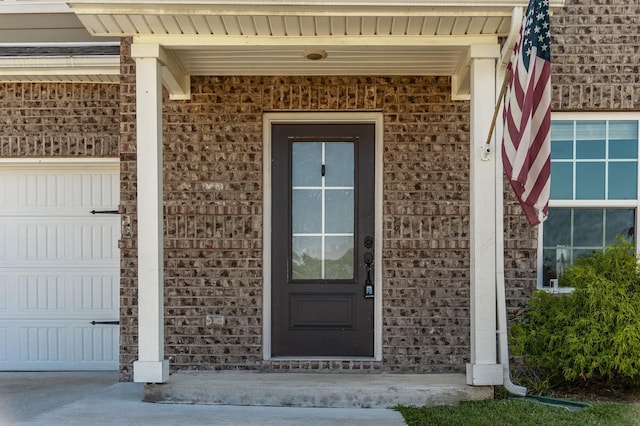 property entrance with a garage