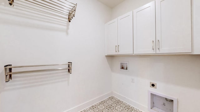 washroom featuring hookup for an electric dryer, cabinets, and washer hookup