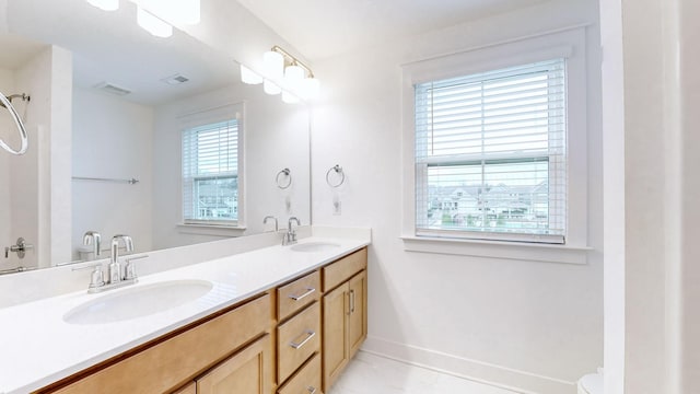 bathroom with vanity and tile patterned flooring